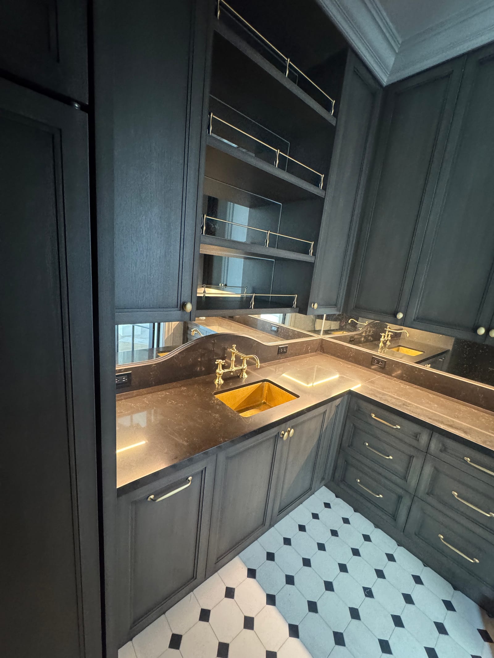 Butler's pantry with brass fixtures detailed and spotless